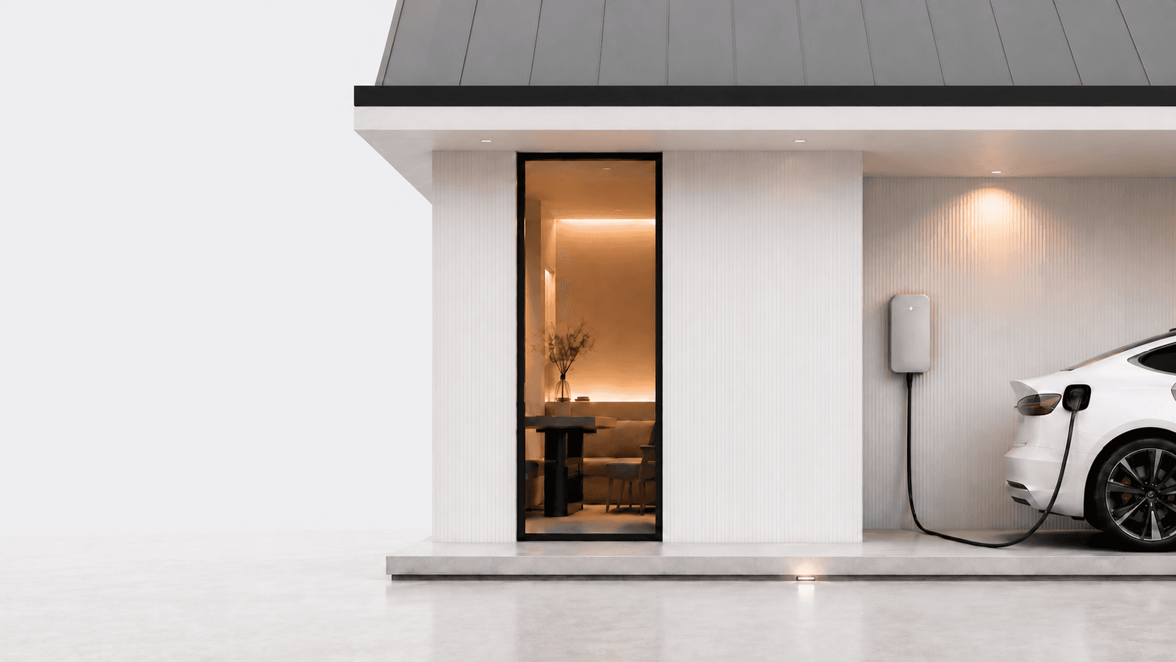 A white Tesla charging from a wall connector at a modern white home at dusk